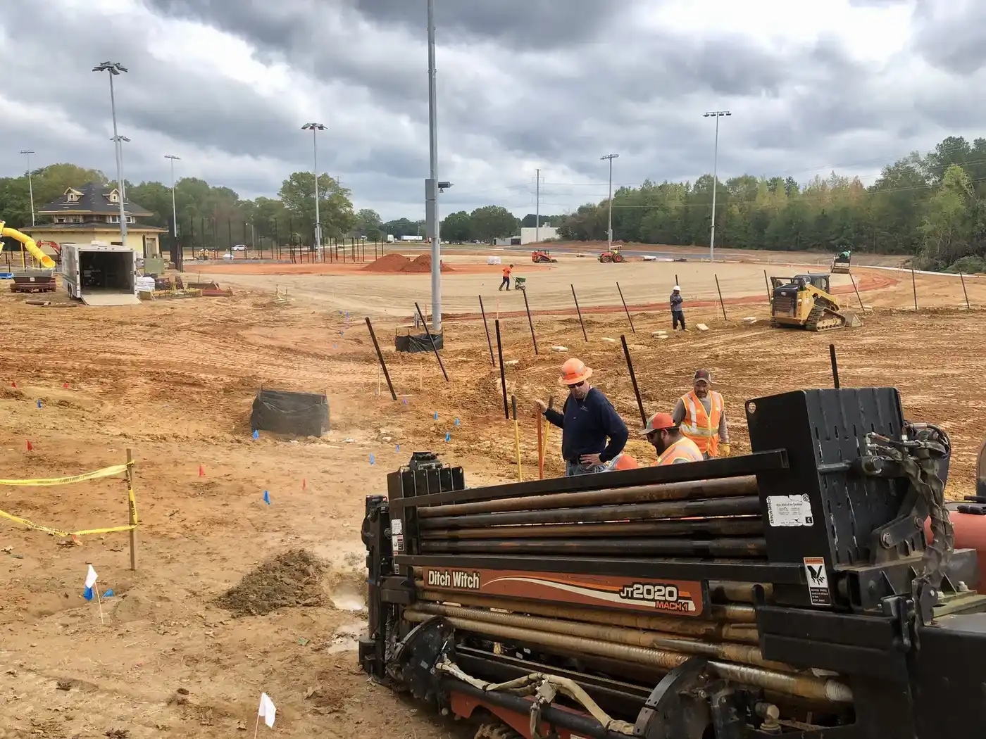 Directional drilling crew boring a utility line on a steep Upstate SC lake lot
