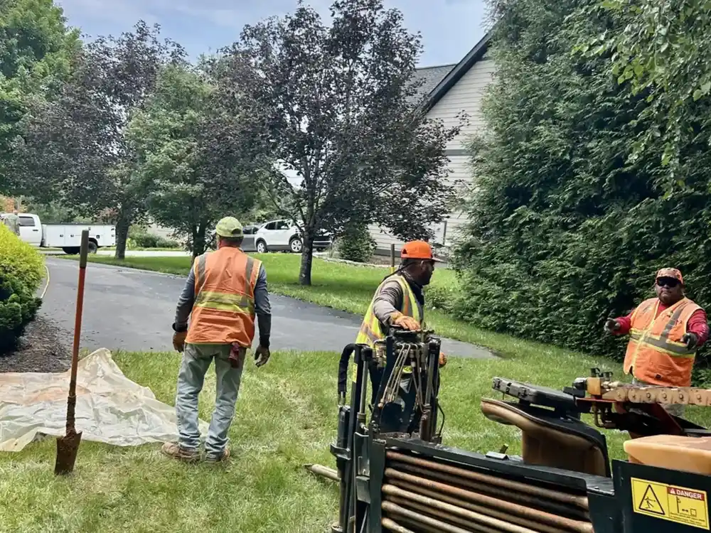 Sloan Underground crew running a directional bore along a residential drive in Mills River, NC