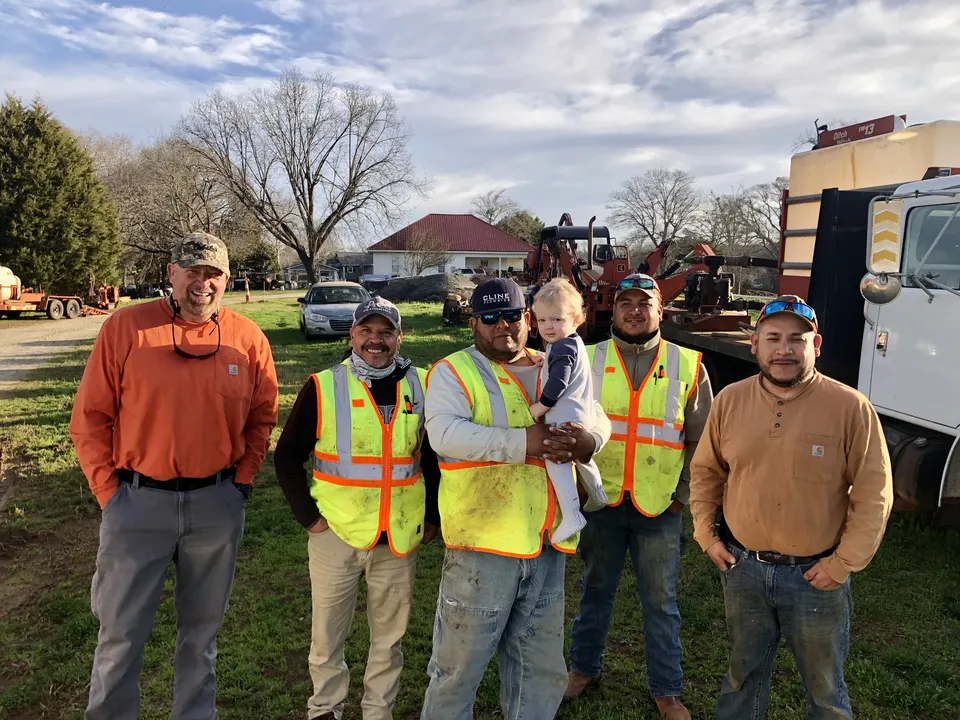 Sloan Underground Construction crew with Ditch Witch directional drilling rig on job site in Greenville South Carolina