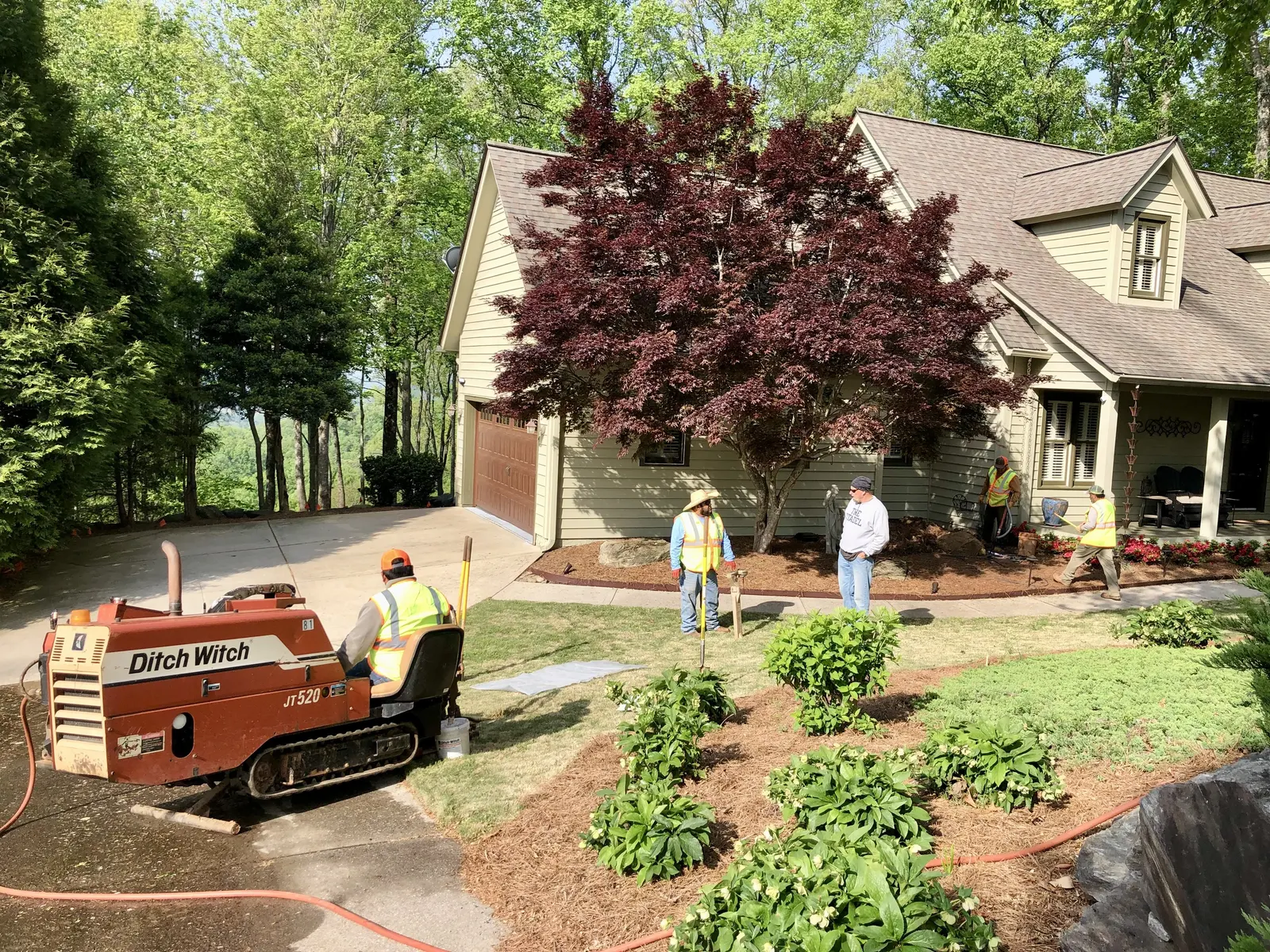 Trenchless pipe installation beneath driveway by directional boring contractor Upstate SC